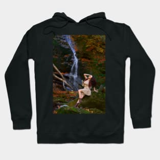 Beautiful young woman by a waterfall Hoodie